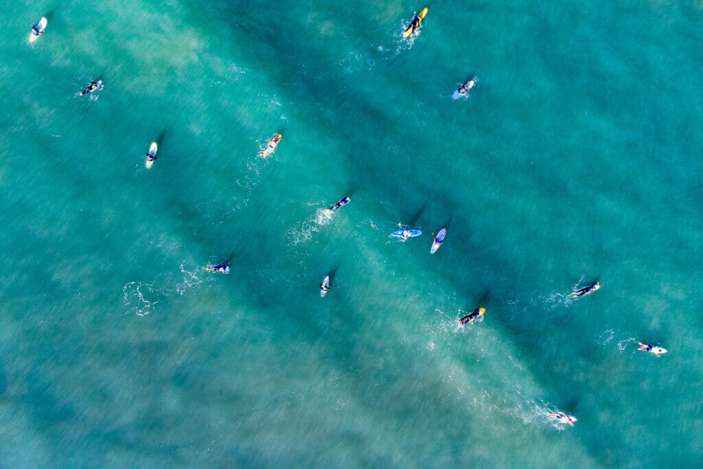 drone shot capturing a surf session from above