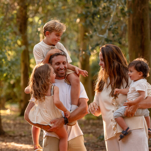 Family photography in the forest at sunset