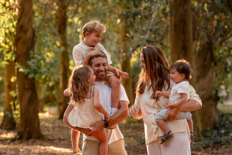 Family photography in the forest at sunset