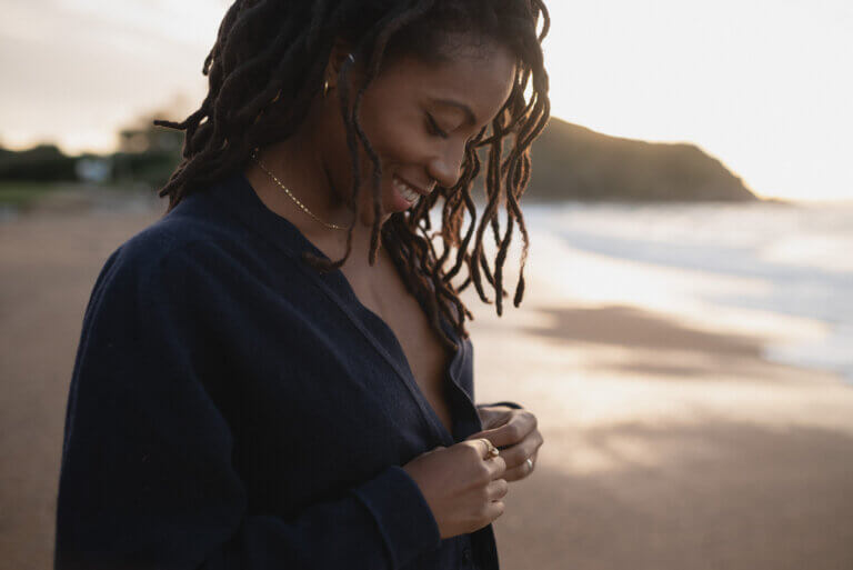 Portrait of black woman during golden hour at the beach in Guethary