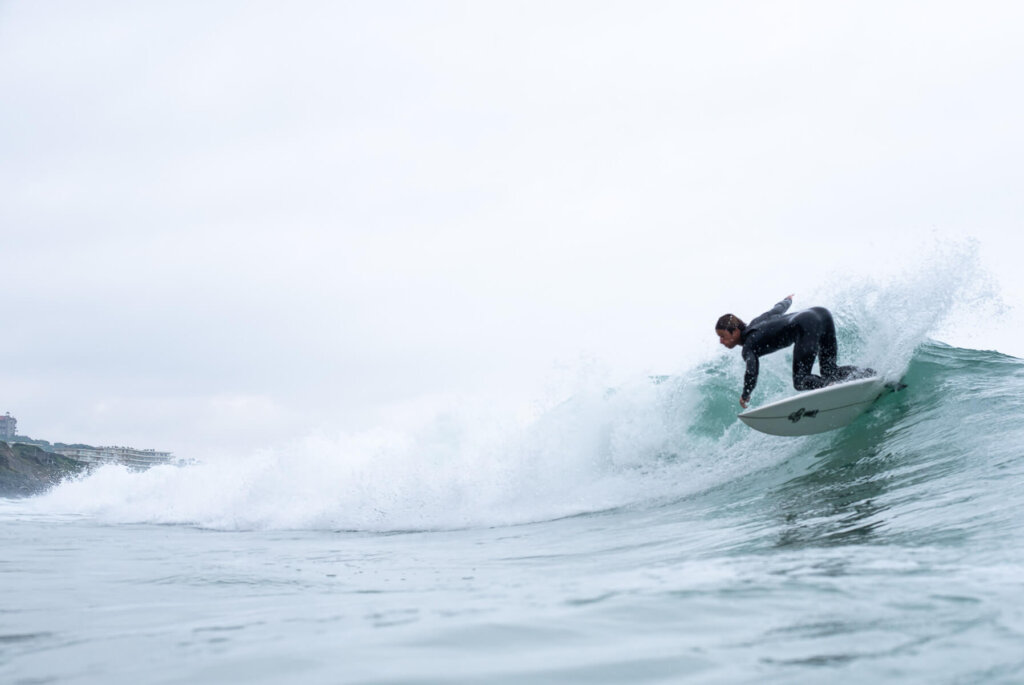 Surfer doing a roller at Cote des Basques, Biarritz