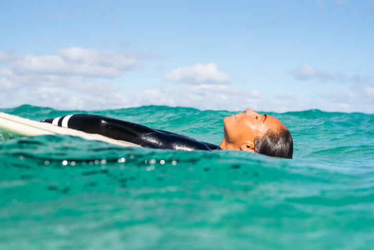in-water portrait of a surfer in the ocean