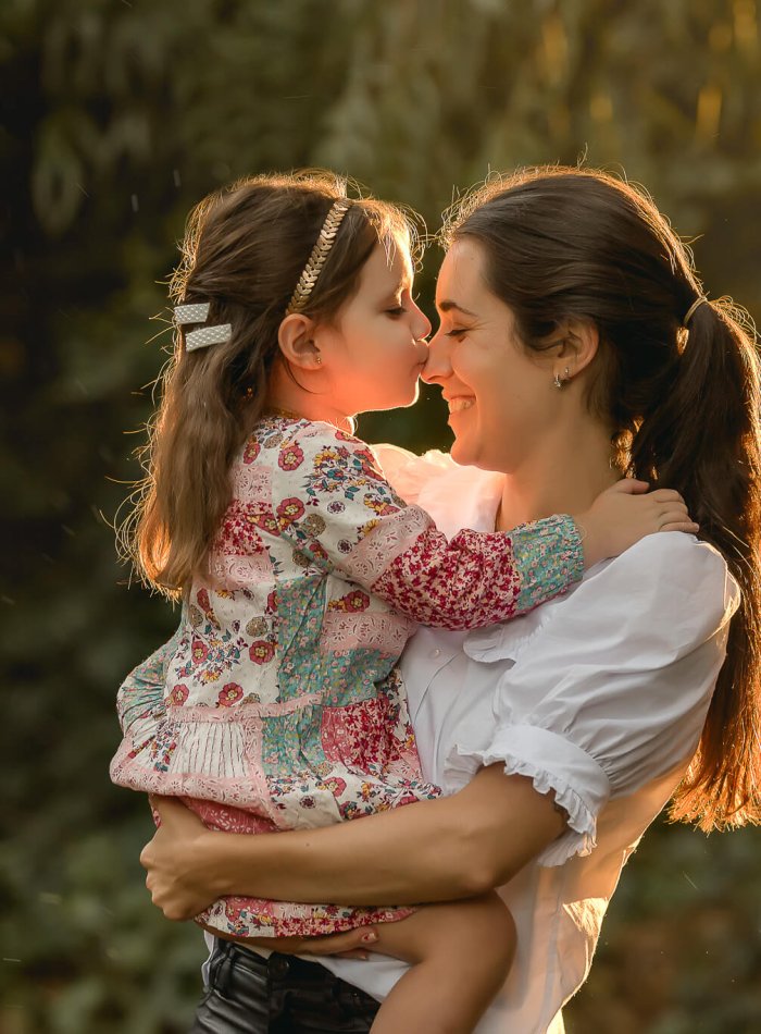 Mother and daughter at sunset in the forest in Anglet
